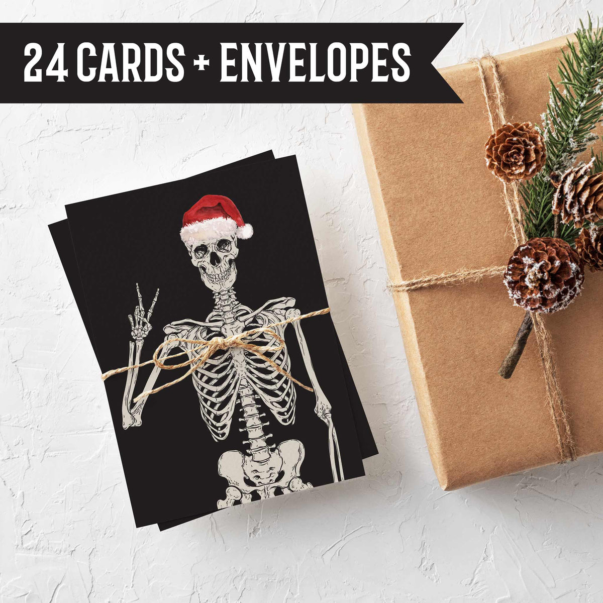 Christmas card pack of 24 featuring festive skeleton illustrations in varying holiday headwear and hand gestures.