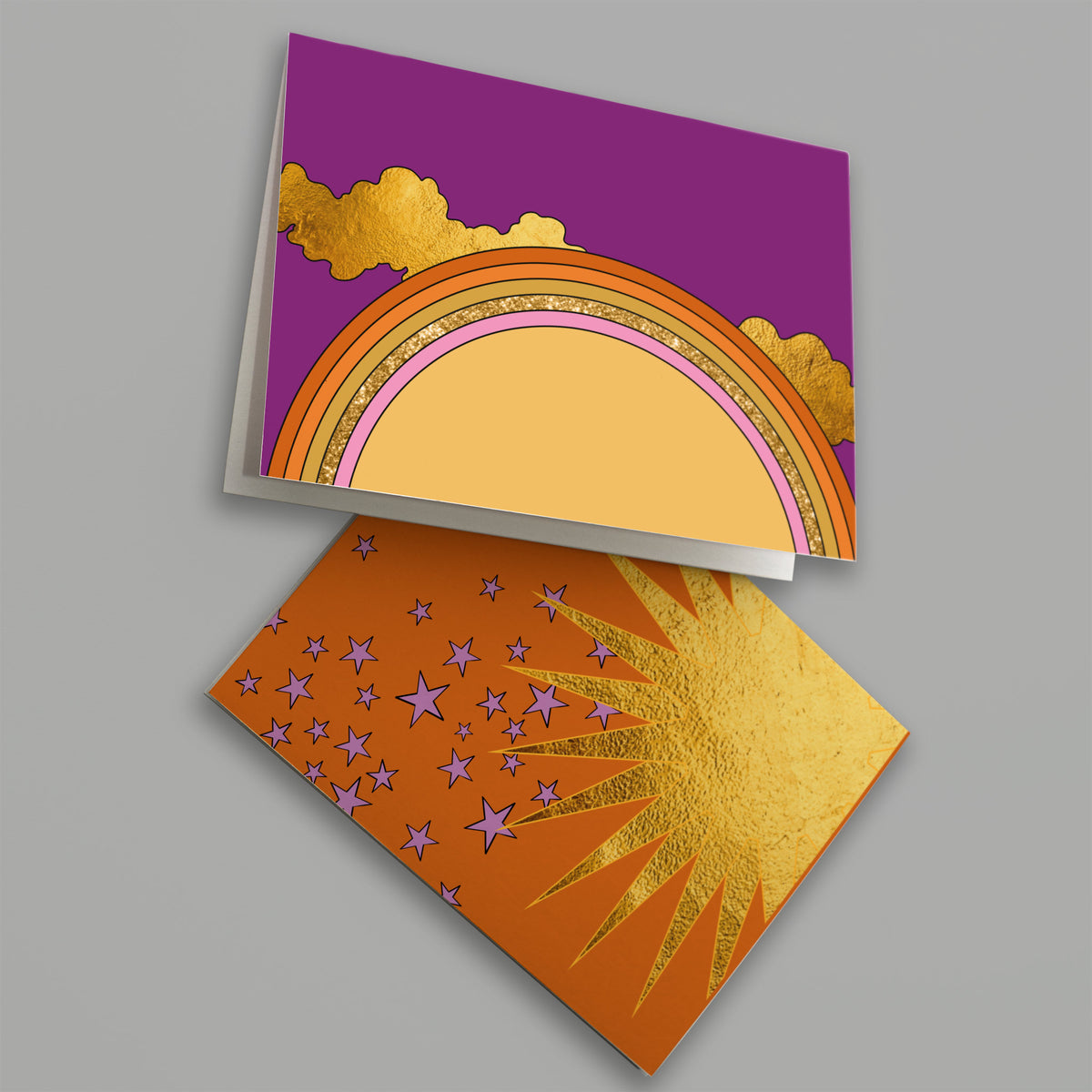 Set of 24 cards with illustrated suns, shooting stars, and sunbursts in a bold, graphic palette.