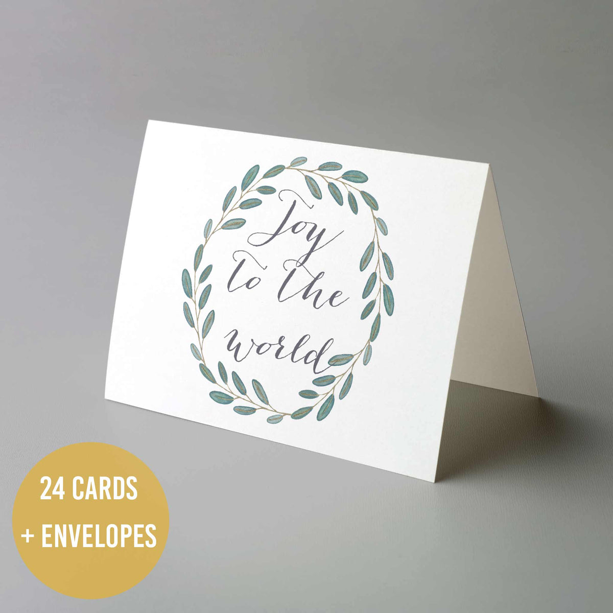 Christmas note card assortment with script and block lettering greetings, botanical details, and envelope set included.
