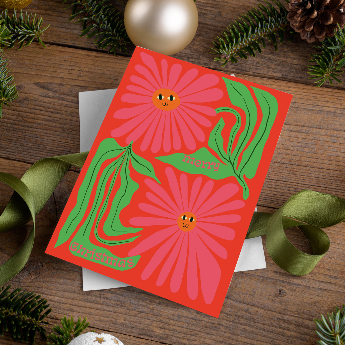 Holiday cards with large cropped floral art and short holiday phrases split across leaf and flower shapes.