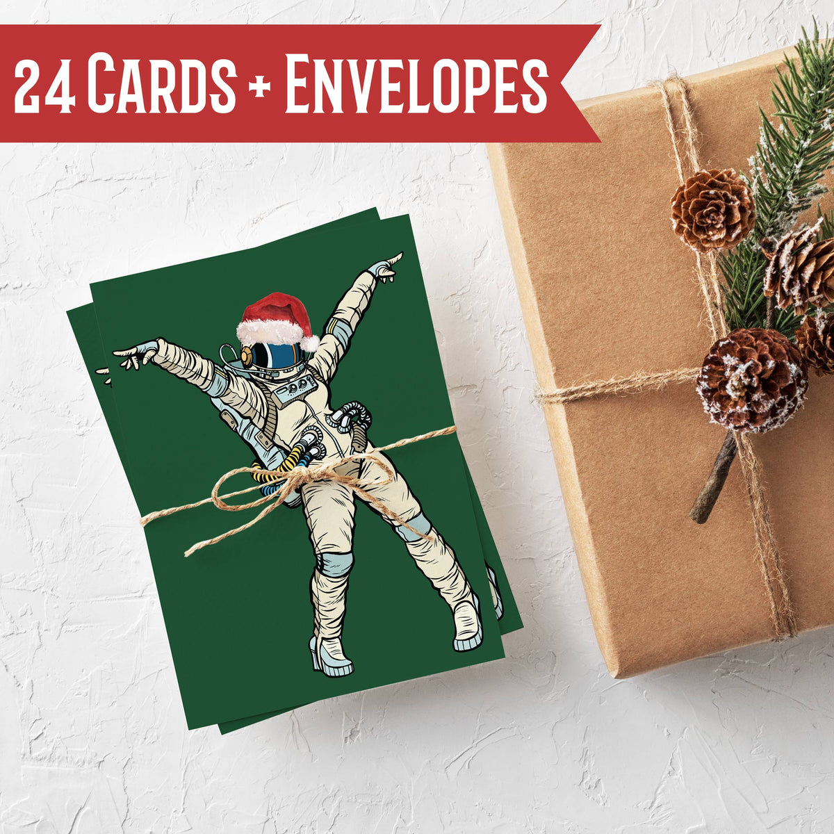 Set of 24 blank-interior holiday cards in four astronaut designs on solid dark green card stock.