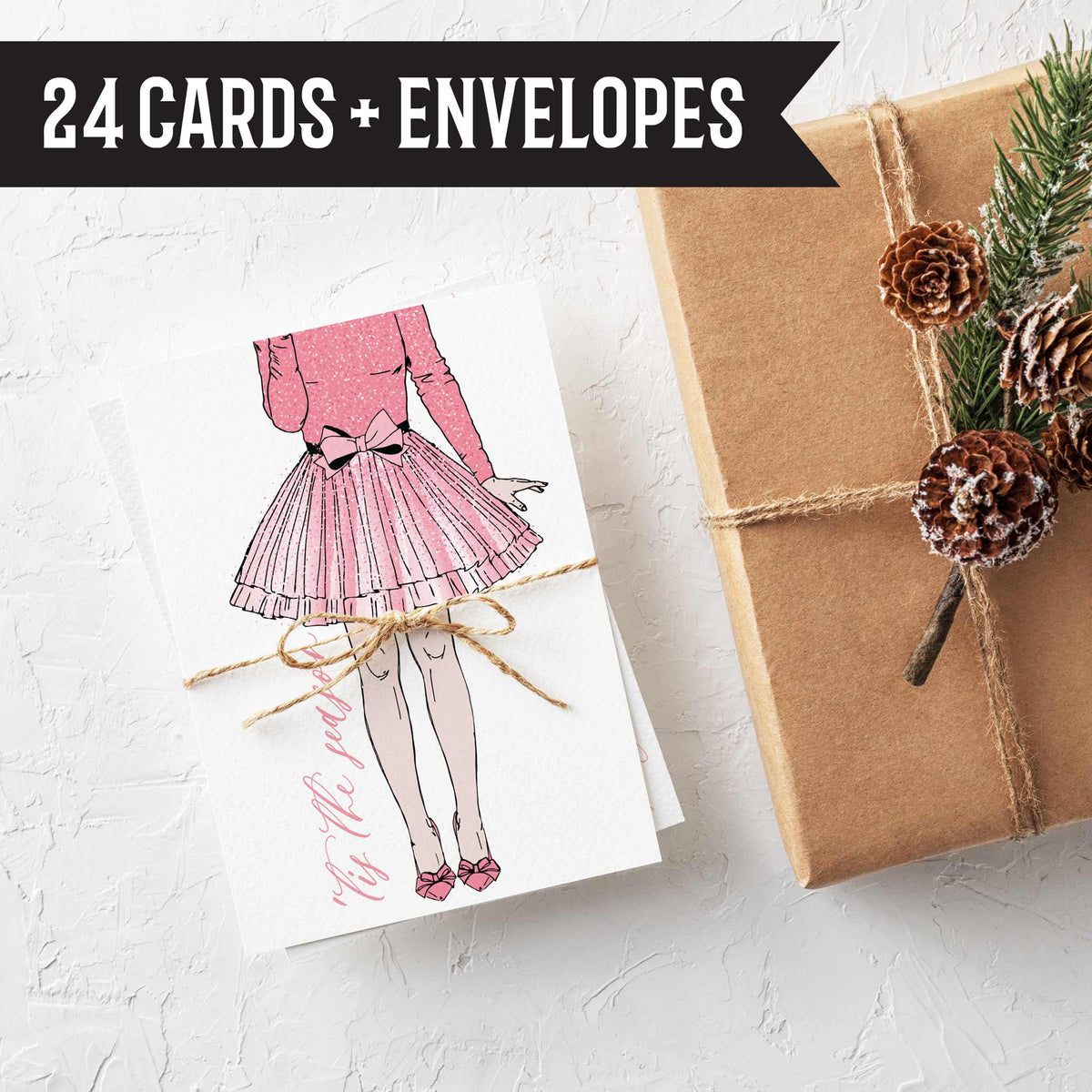 Holiday card set of 24, illustrated in pink line art on white, designs include trees, wrapped gifts, and bowed balloons.