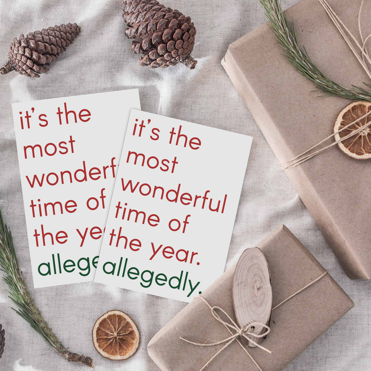 Box of 24 holiday cards in a single design with red and green lowercase text on a white card face.