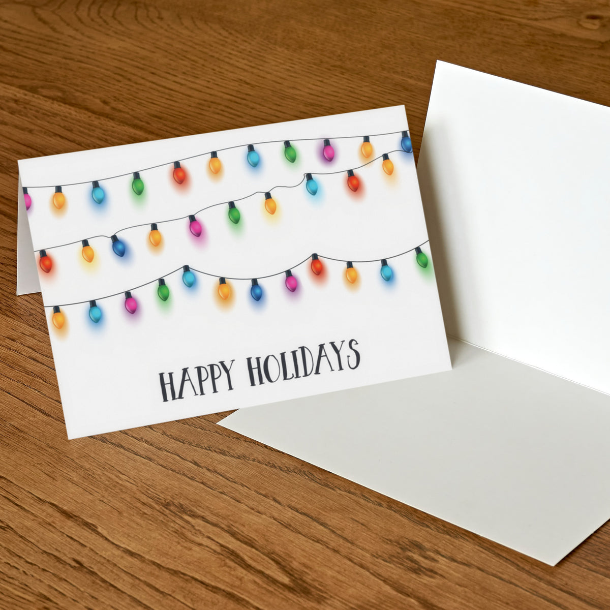 Multicolor string light card with orange, pink, teal, purple, green, blue, and red bulbs; white background.