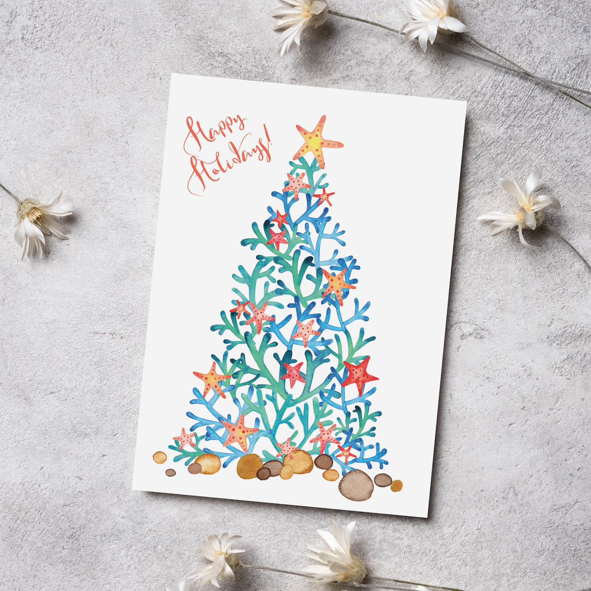Set of 24 cards split between red-script and green-script versions of the same coral and starfish tree illustration.