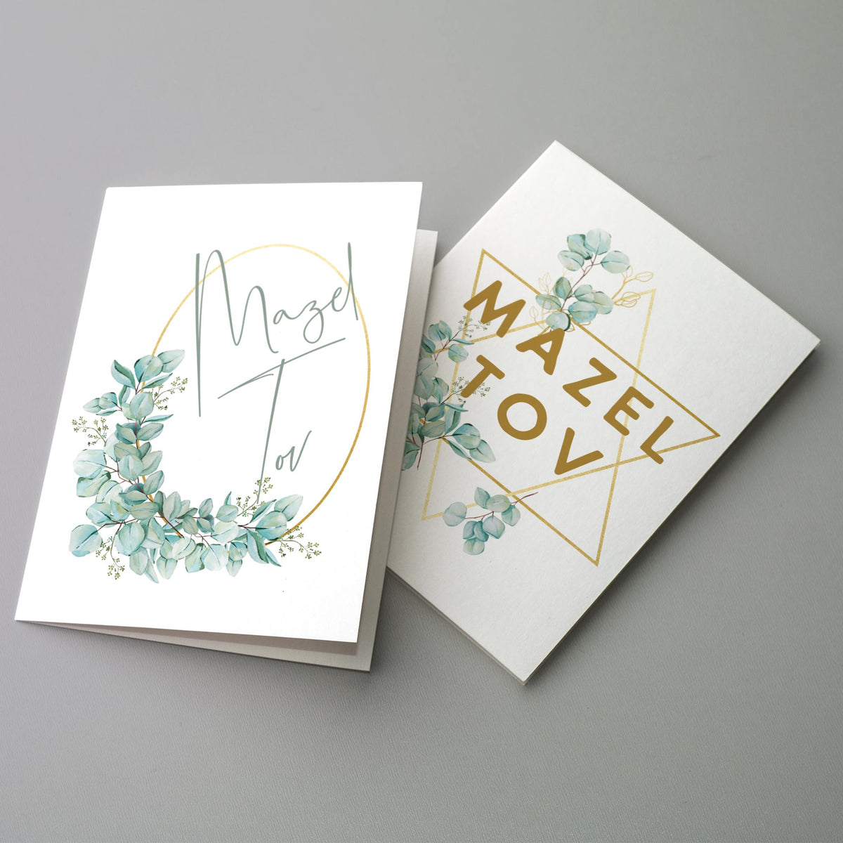 Card set with geometric Star of David and polygon frames, botanical illustrations, and Mazel Tov lettering.