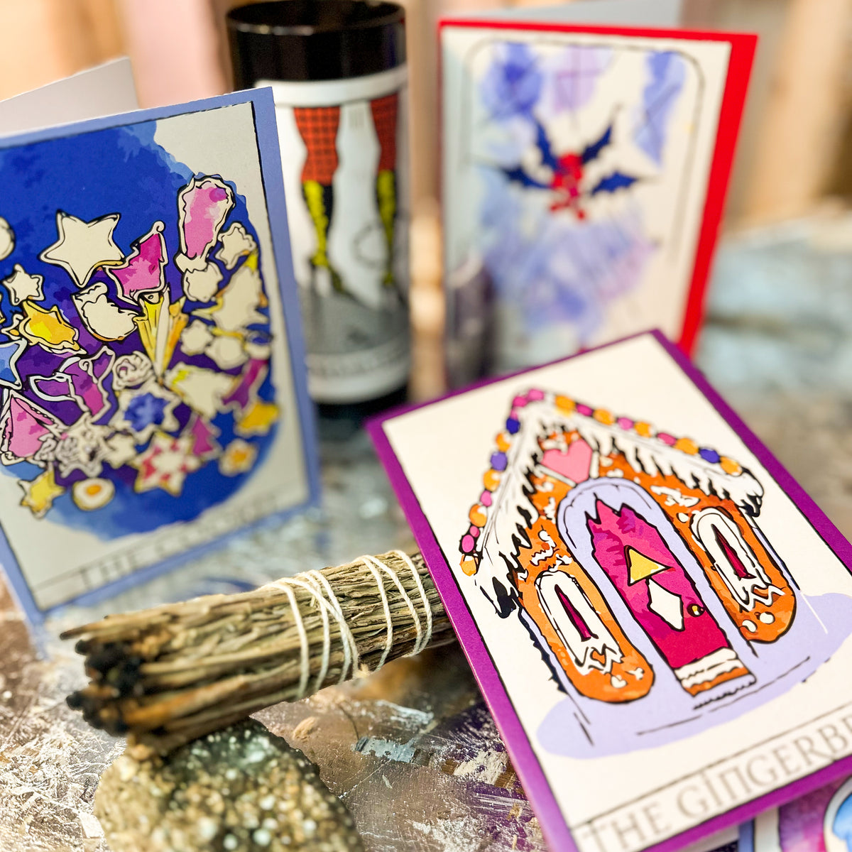 Each card features a watercolor-wash illustration with black ink outlines, stars, and decorative accent shapes.