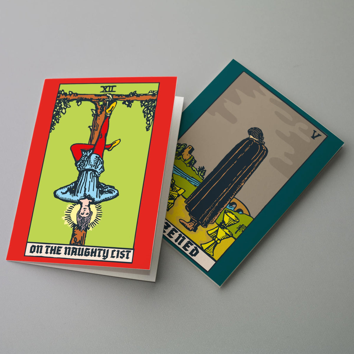 Set of 24 tarot-themed Christmas cards with colored borders and captions including "GINGLE ALL THE WAY" and "DON'T STOP BELIE