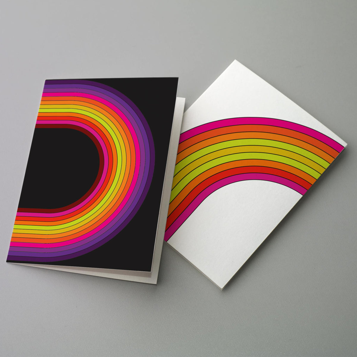 Card set with designs in deep purple, violet, hot pink, orange, yellow-green, chartreuse, and black.