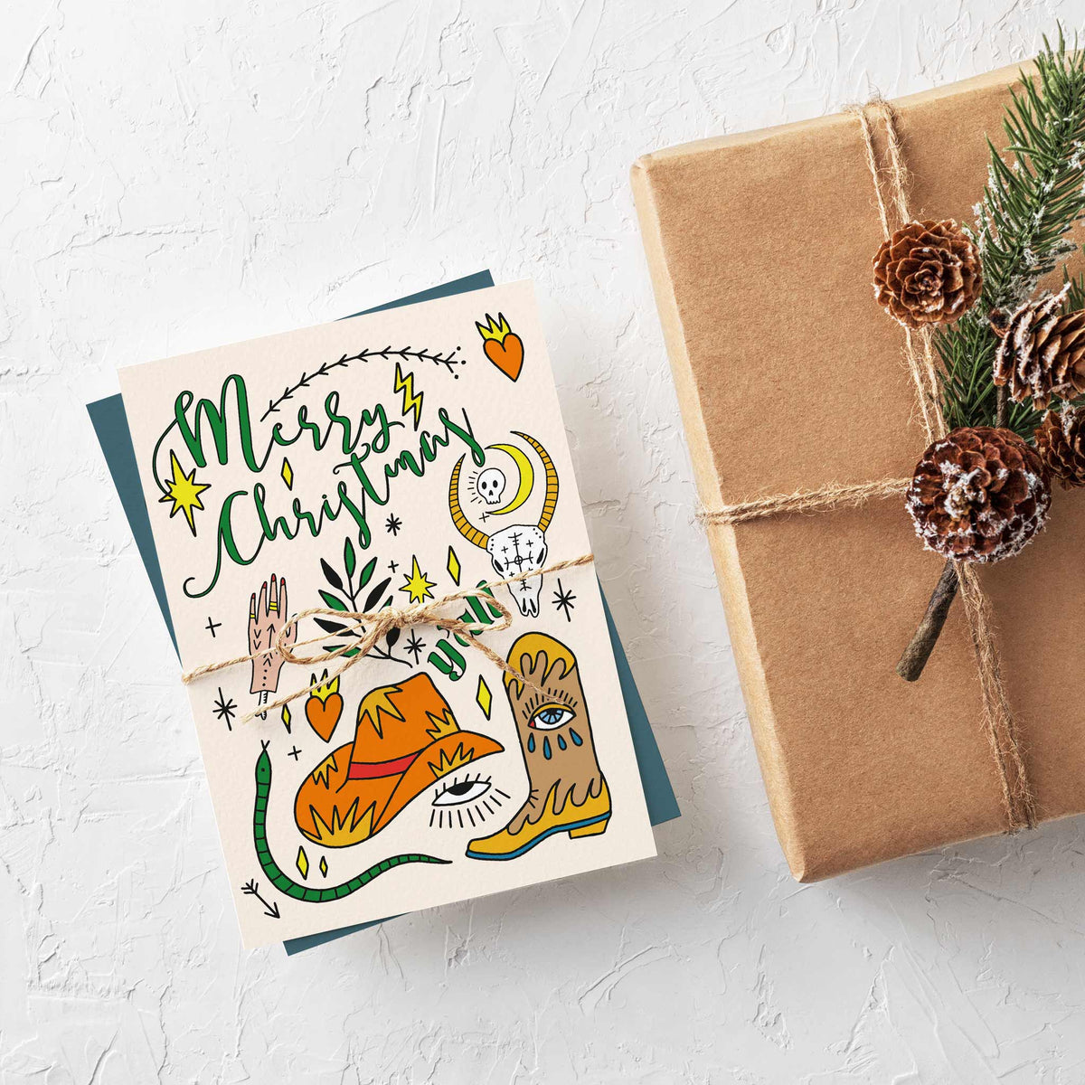 Western Christmas cards with "Merry Christmas" in flowing script and "y'all" in wide outlined lettering, 24 cards total.