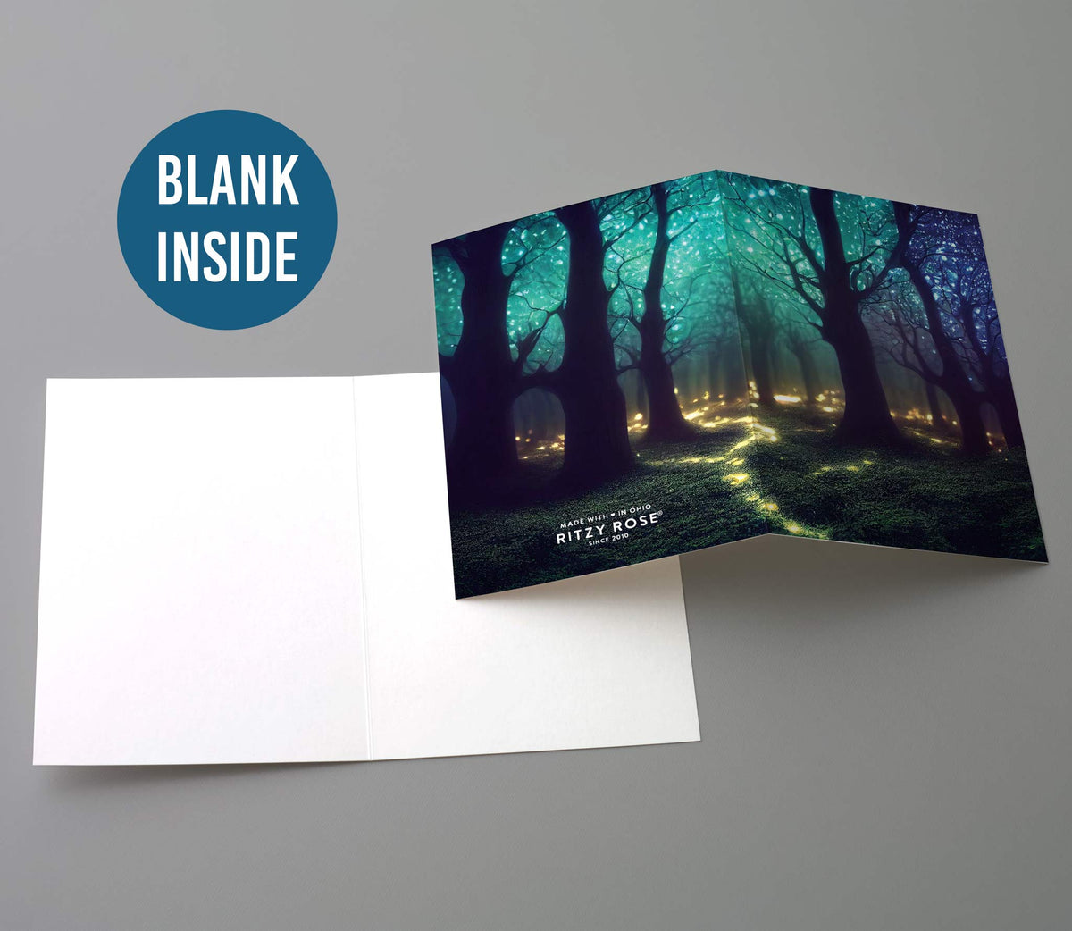 Cards, six designs, digital painting-style forest illustrations with glowing light points and jewel-tone fields.