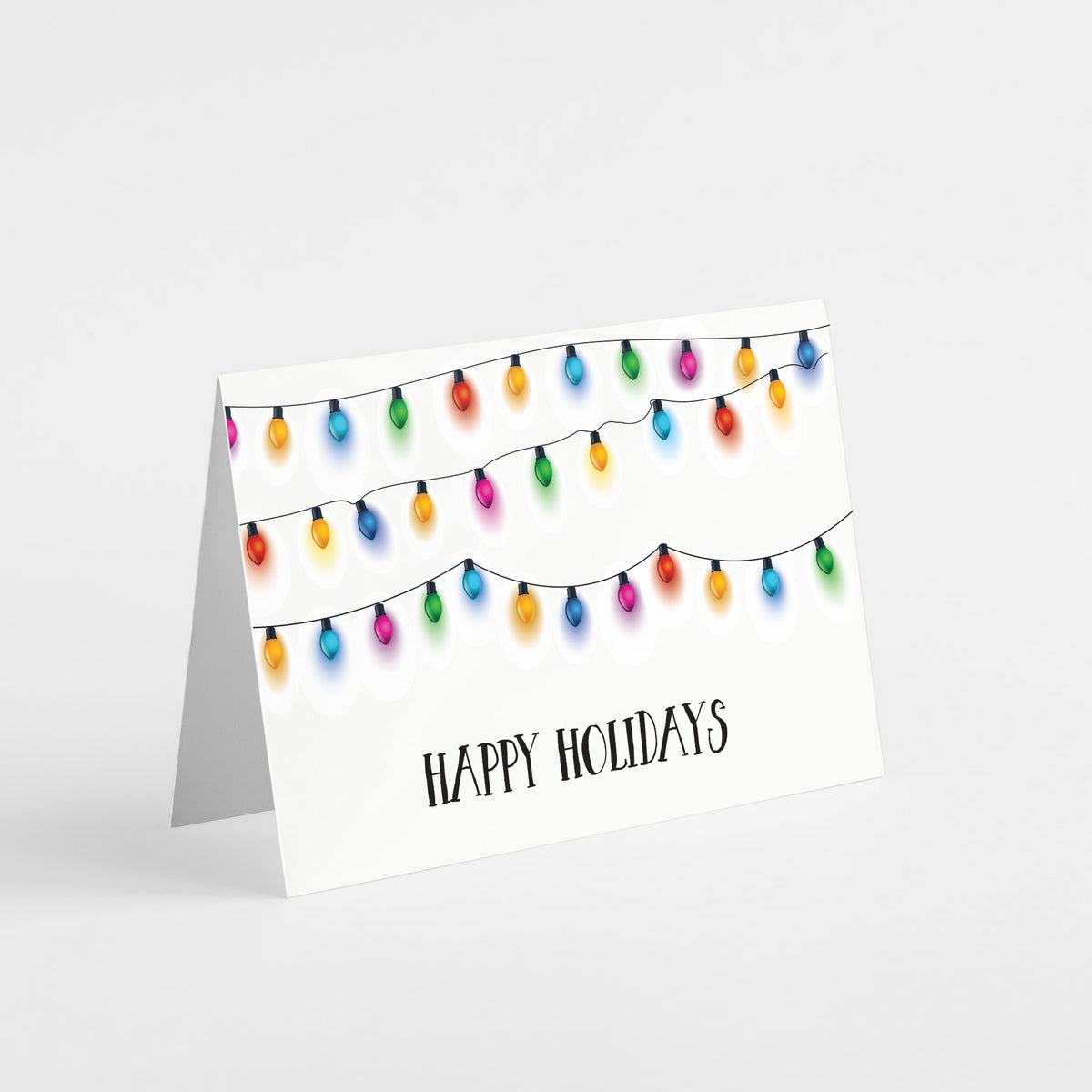 Set of 24 holiday cards featuring oval string light bulbs in orange, blue, green, red, pink, teal, and purple.