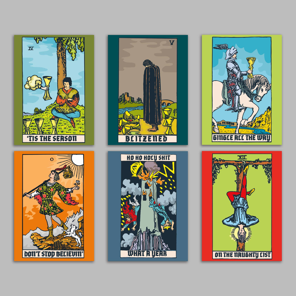 Set of 24 Christmas cards featuring illustrated tarot card designs with humorous holiday captions on cream banner scrolls.