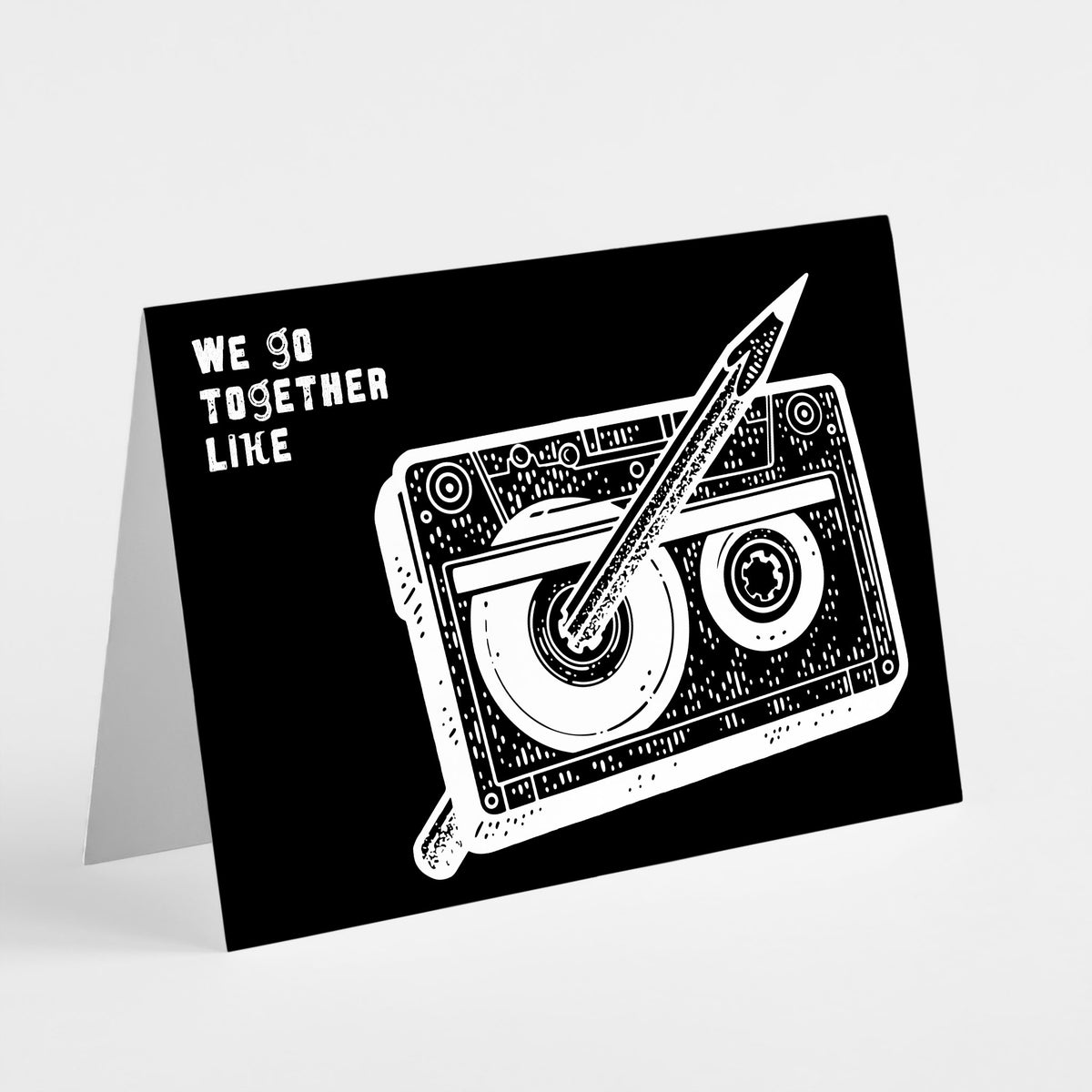 Set of 24 black landscape cards featuring a cassette tape threaded with a pencil and distressed white lettering.