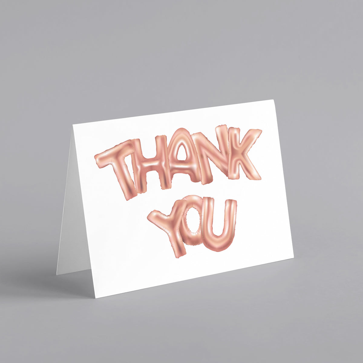 Boxed set of 24 thank you cards featuring bold uppercase balloon-style text in pink metallic finish.