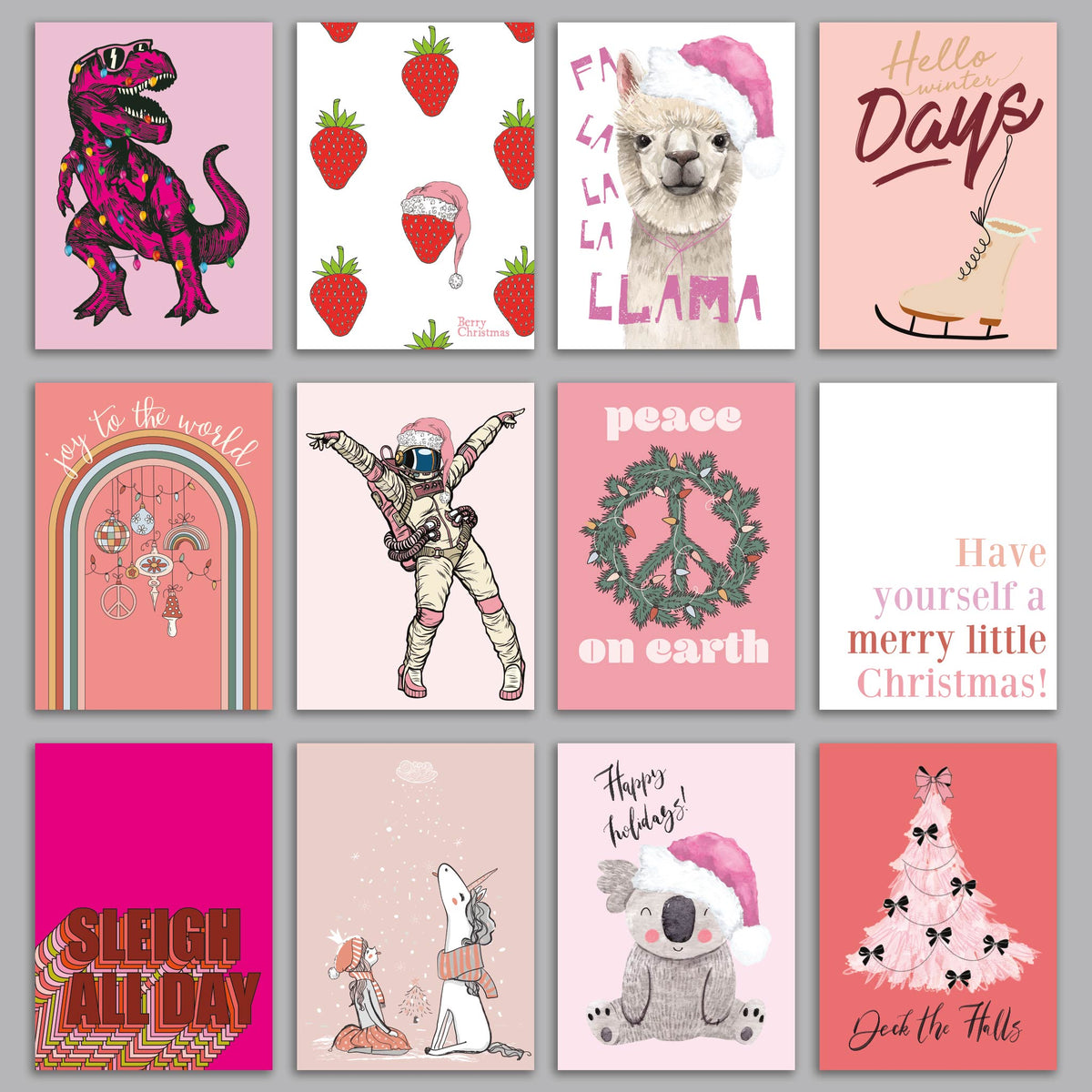 Pink Christmas card set with novelty designs including a T-rex, koala, alpaca, unicorn, and astronaut illustrations.