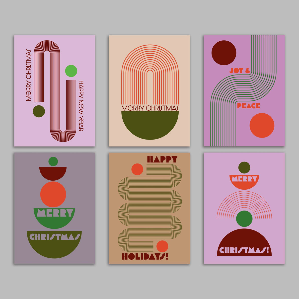 Set of 24 holiday cards featuring concentric-line arches, circles, and half-circle bowls in earthy and jewel tones.