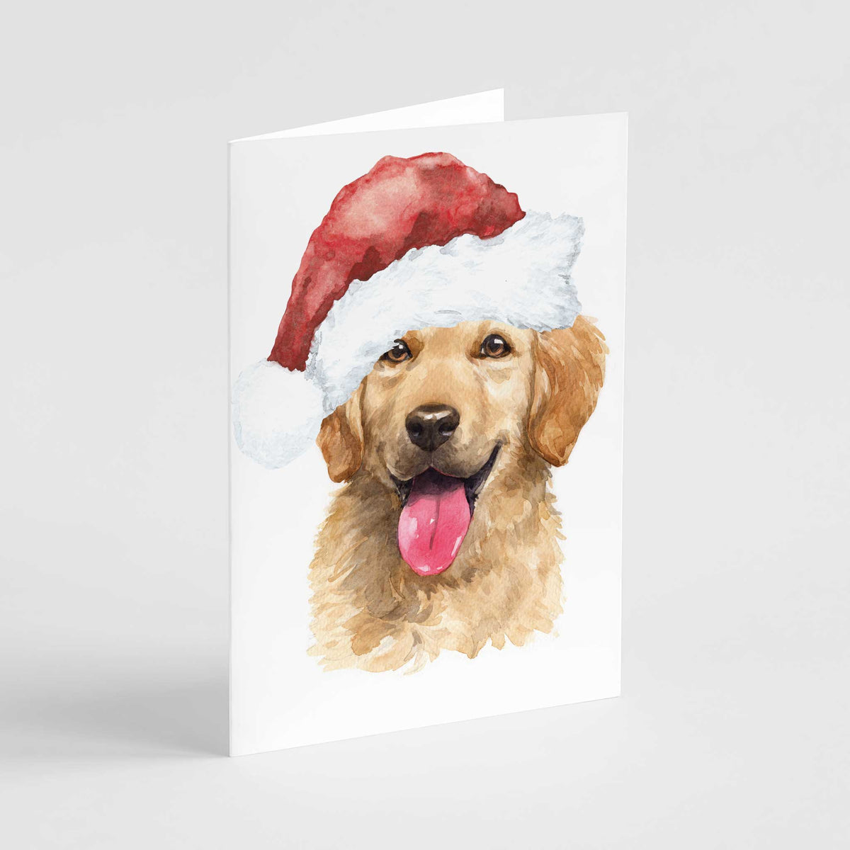 Watercolor golden retriever in a red Santa hat, mouth open and tongue out, centered on a white card face.