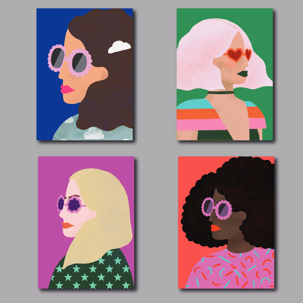 Boxed set of 24 greeting cards featuring four portrait illustrations, six cards per design.
