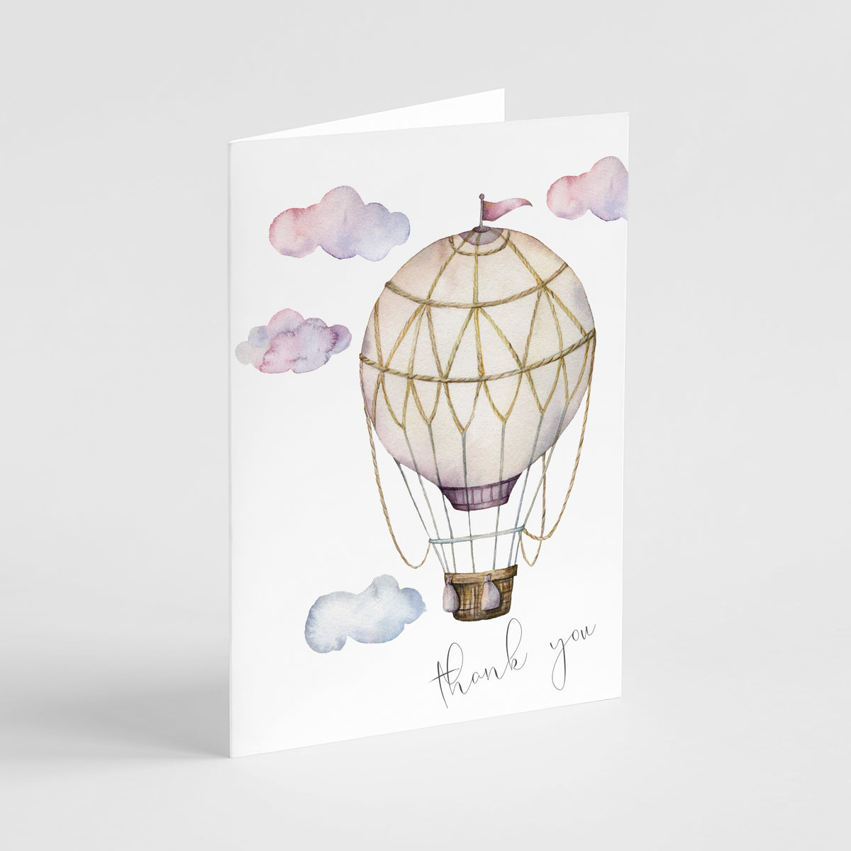 Folded thank you card set featuring a script "thank you" phrase and illustrated hot air balloon.