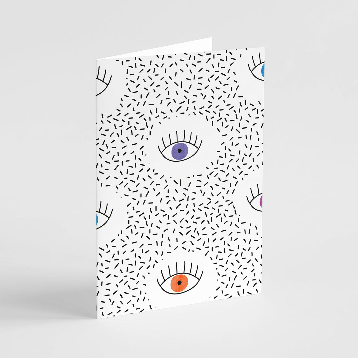Set of 24 notecards featuring a repeating illustrated eye motif in purple, blue, orange, and pink.