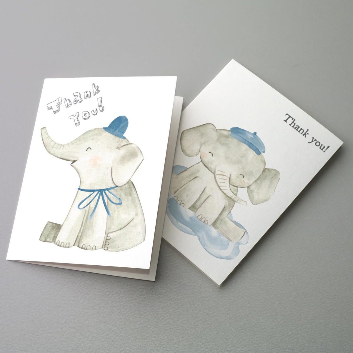 Card set featuring two alternating elephant designs with printed "Thank you!" text in playful hand-drawn lettering.
