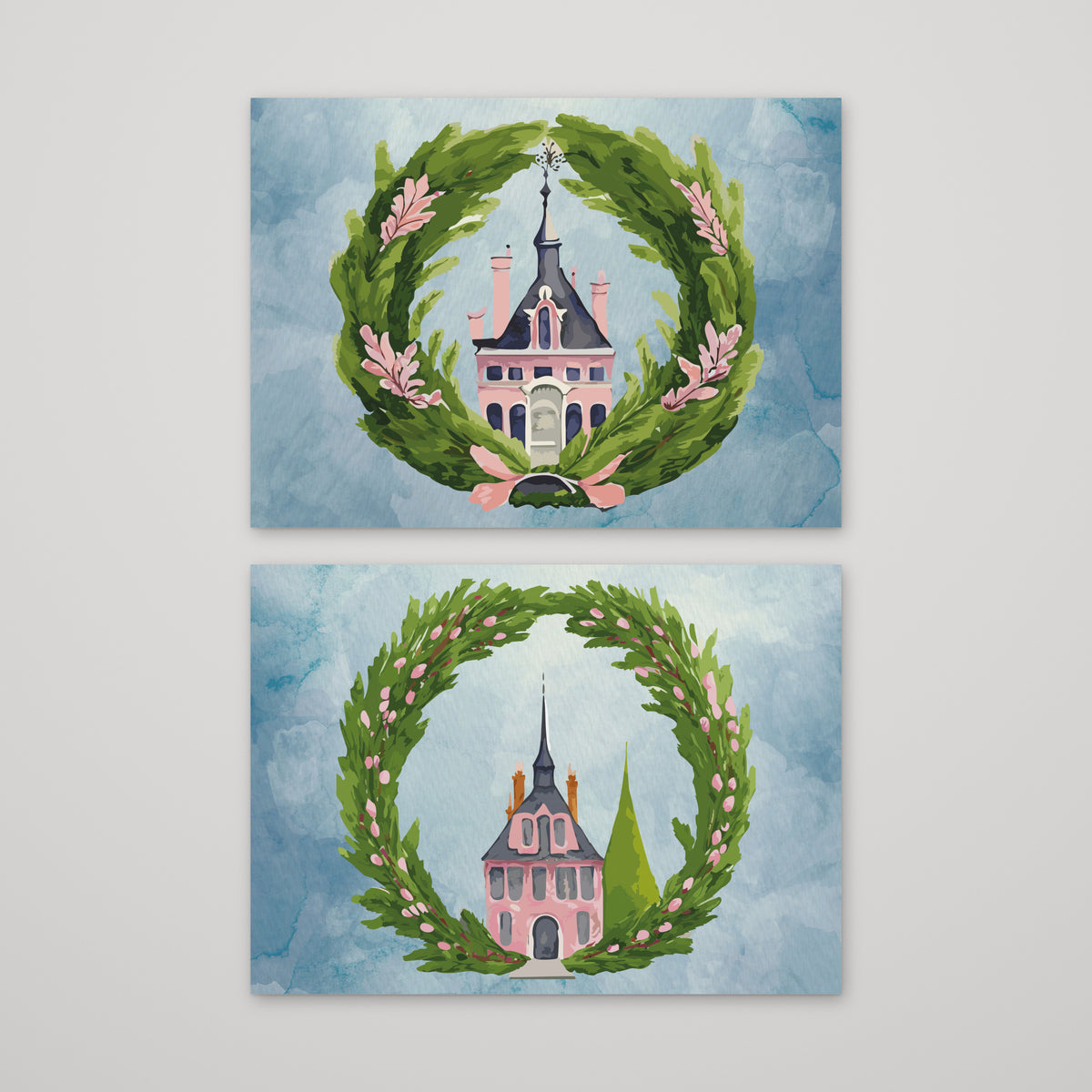 Card set with two holiday designs showing a pink spired building centered in a round evergreen wreath.