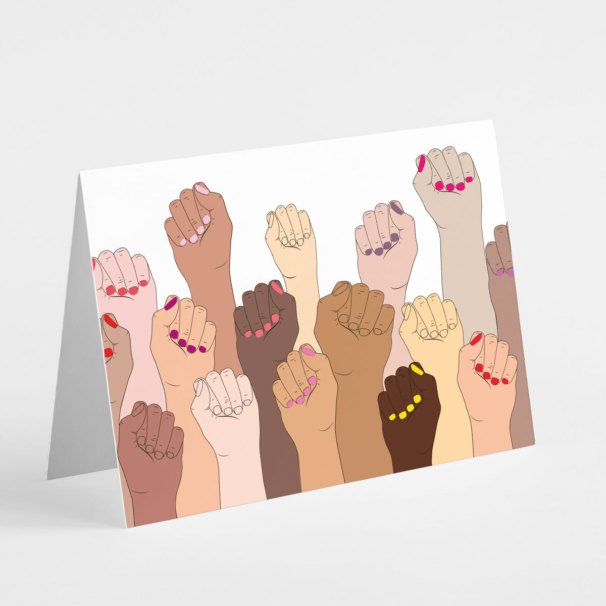 Card set with one design showing densely packed raised fists and forearms in varied skin tones.