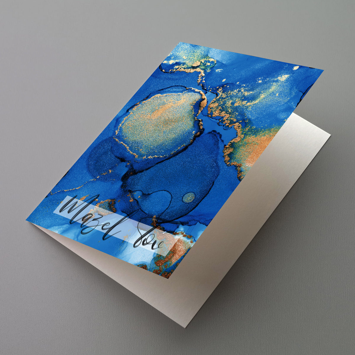 Card set featuring a deep cobalt and gold fluid abstract design with "Mazel tov" in script.