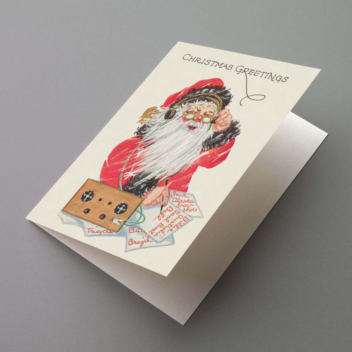 Set of 24 Christmas cards featuring Santa in a red coat listening to a crystal radio receiver.