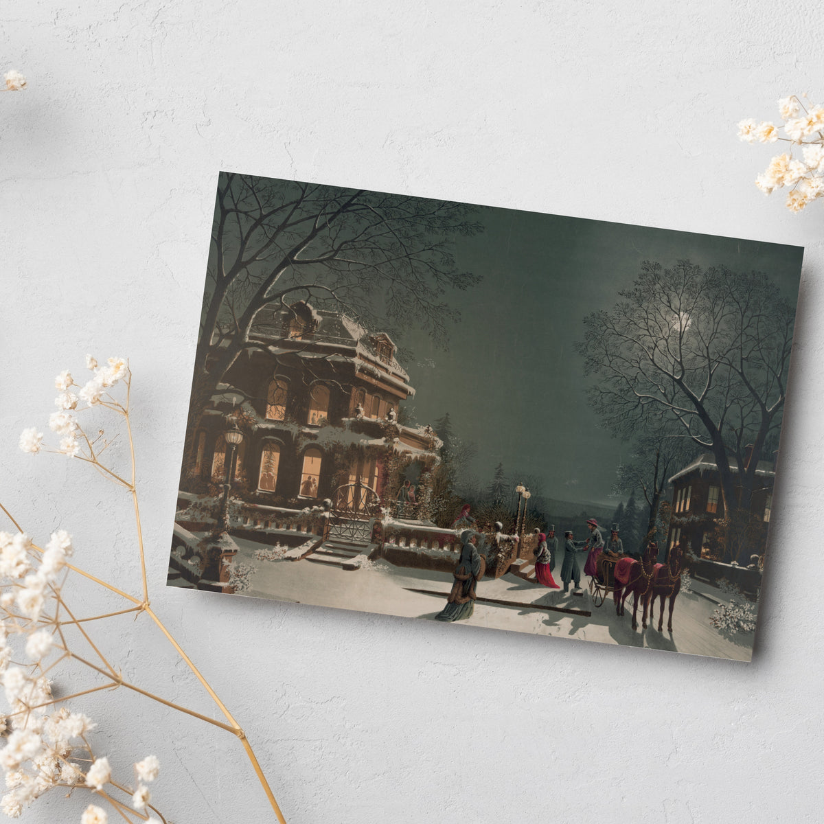 Set of 24 identical Christmas cards showing a snowy lamplit street with a mansion and horse-drawn carriage.