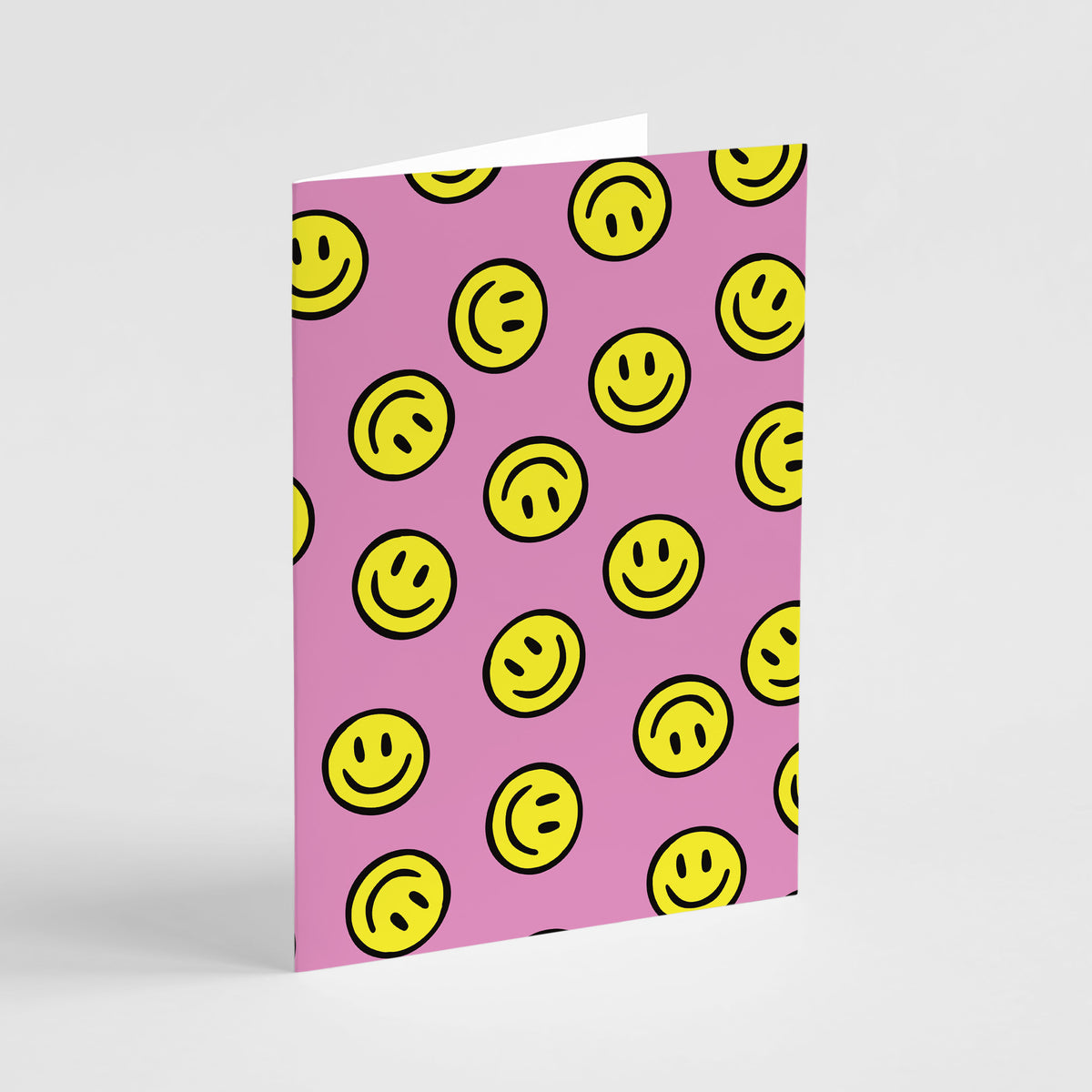 Card set featuring bold yellow smiley face icons with black outlines on pink.