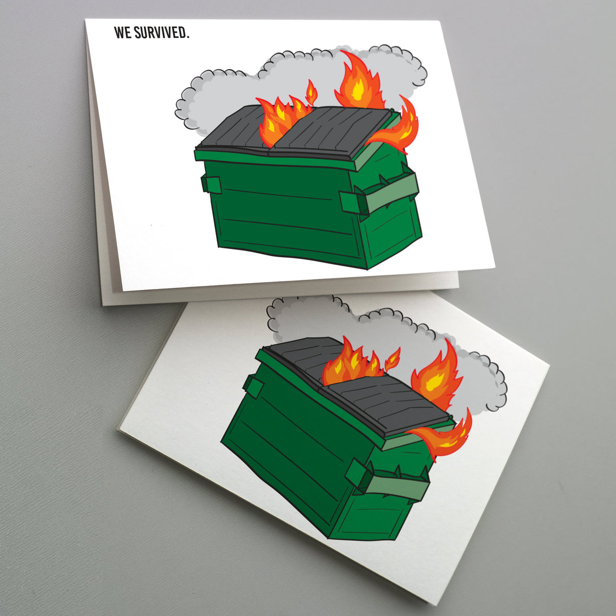Landscape card with WE SURVIVED. in bold black sans-serif at upper left and a flat illustration of a flaming green dumpster.