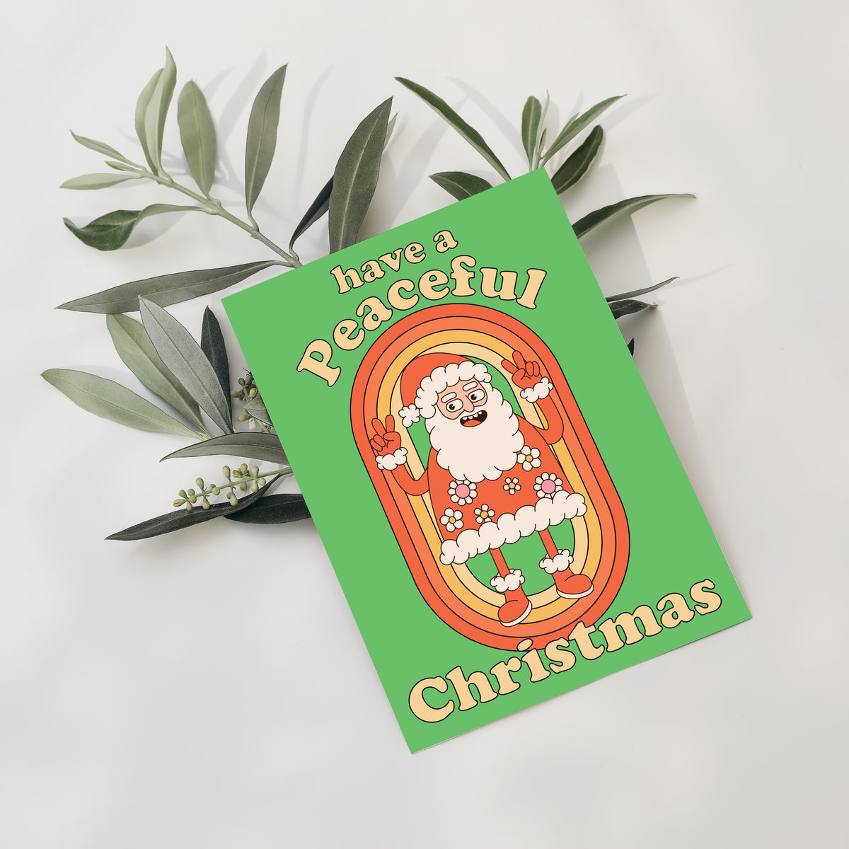 Folded Christmas cards in a 1970s illustration style with thick black outlines and a warm vintage color palette.
