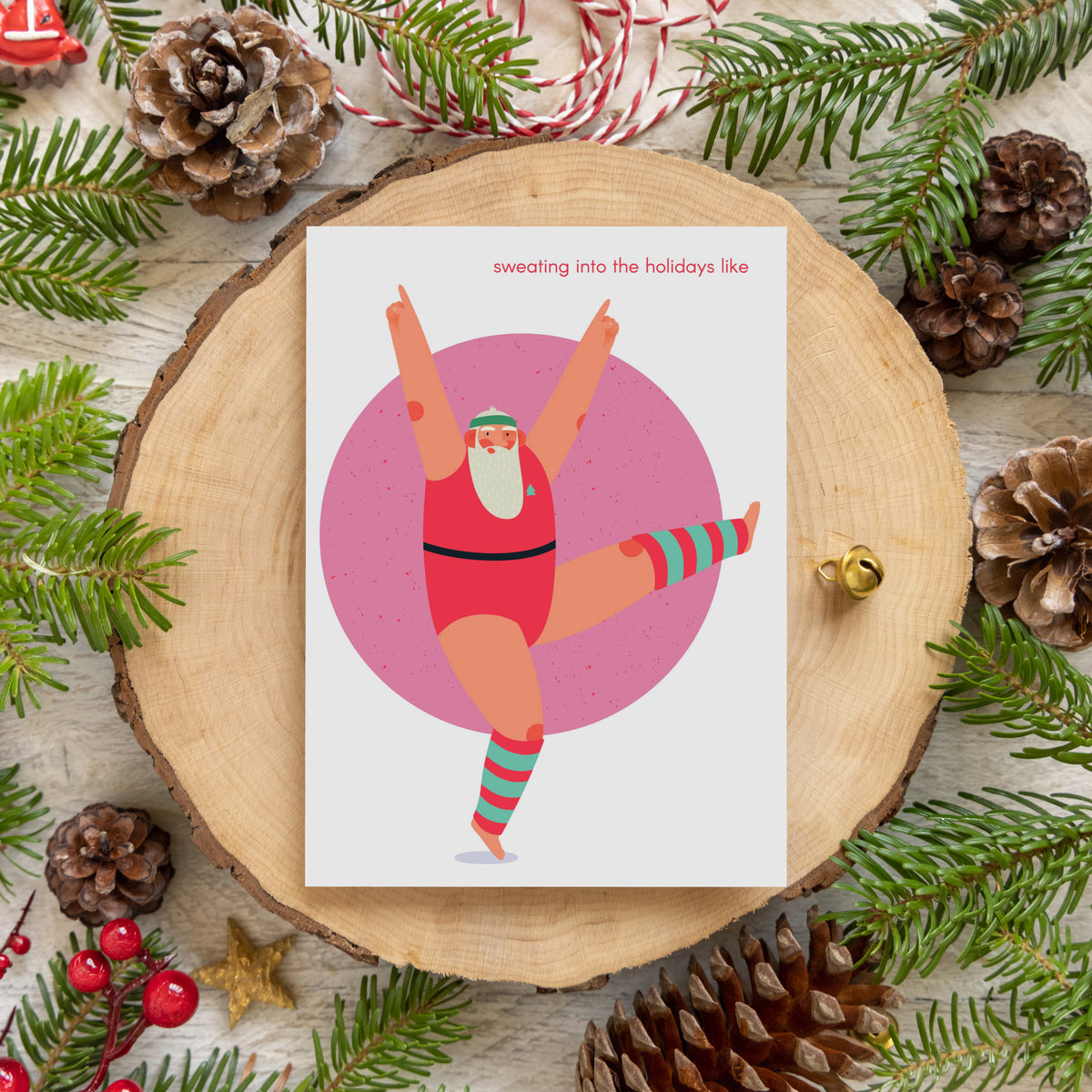 Box of 24 holiday cards with Santa exercising, four designs, small red humorous phrases.