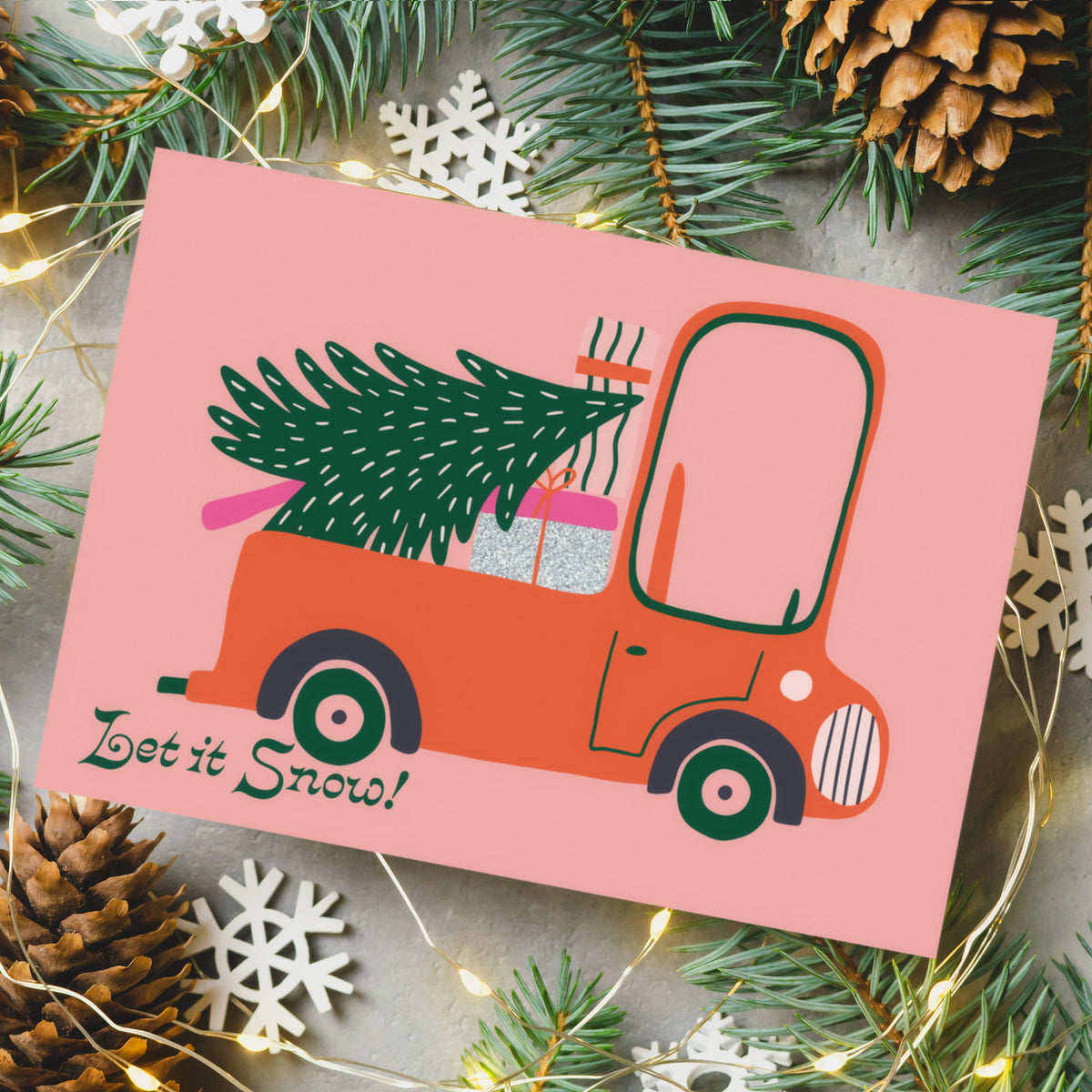 Holiday card set with 4 designs: hatchback, pickup truck, vintage truck, and van with trailer.