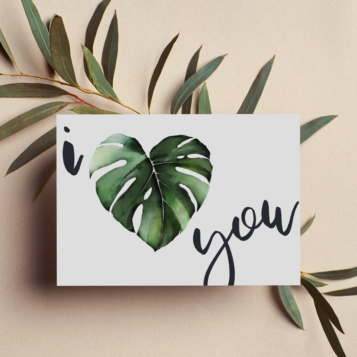 Card set with a botanical heart leaf design in green, black, and white on a white background.