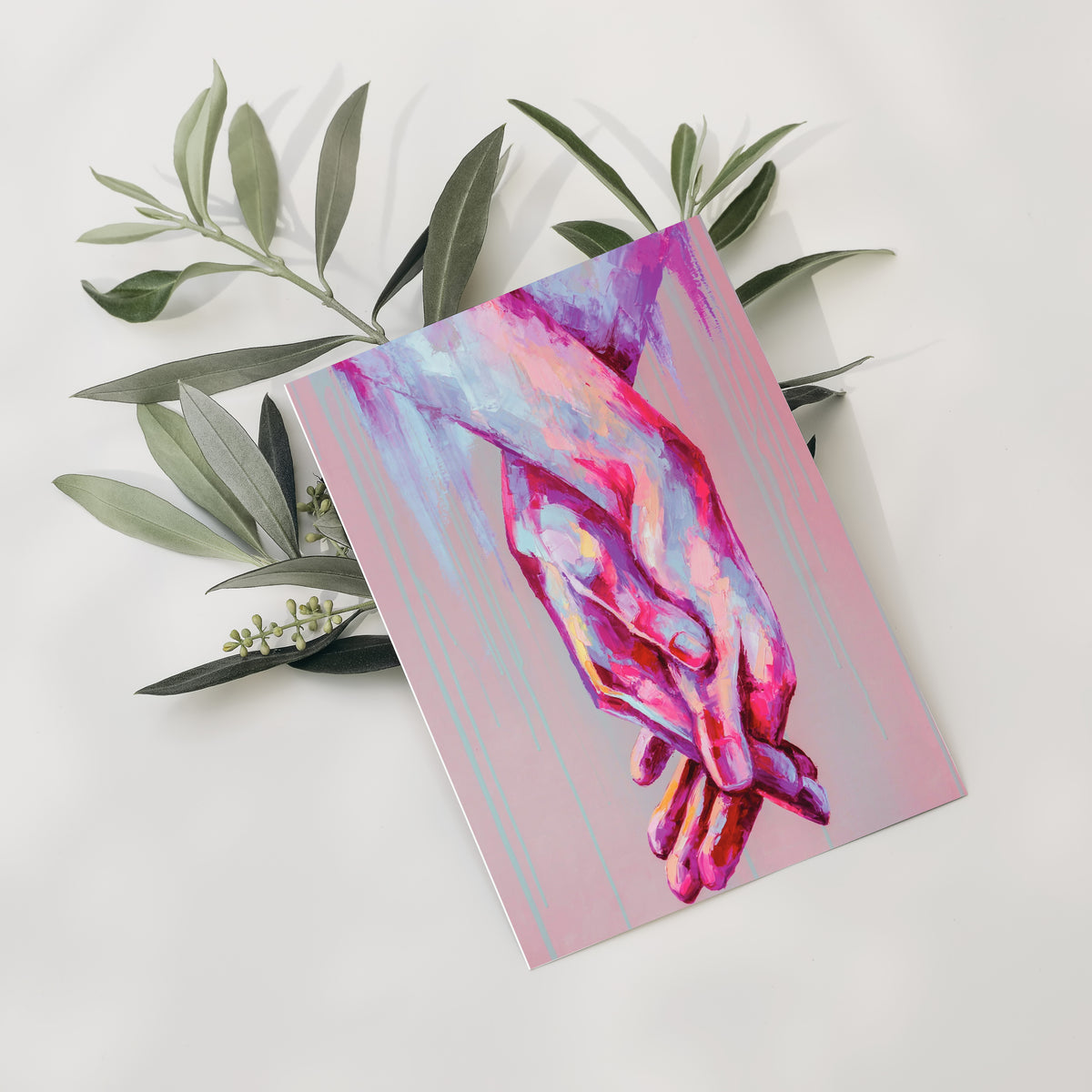 Set of 24 cards with a full-bleed brushstroke design of two hands with fingers interlaced, rendered in hot pink and peach-cre