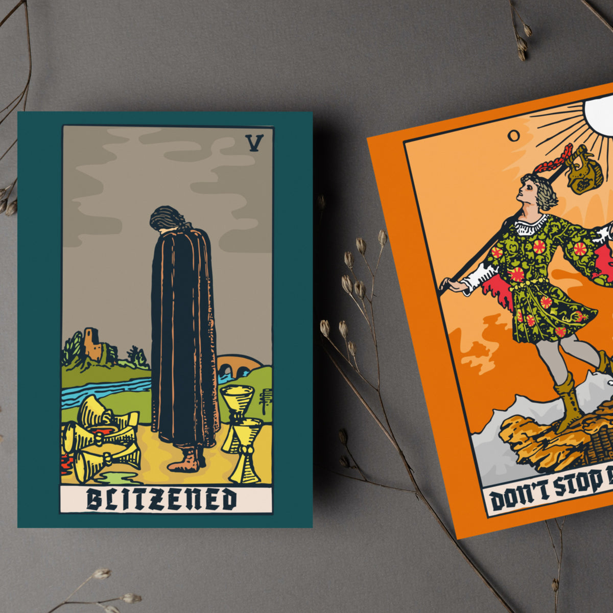 Six tarot-inspired card designs including the Fool, Tower, and Hanged Man with punny Christmas phrases in blackletter type.