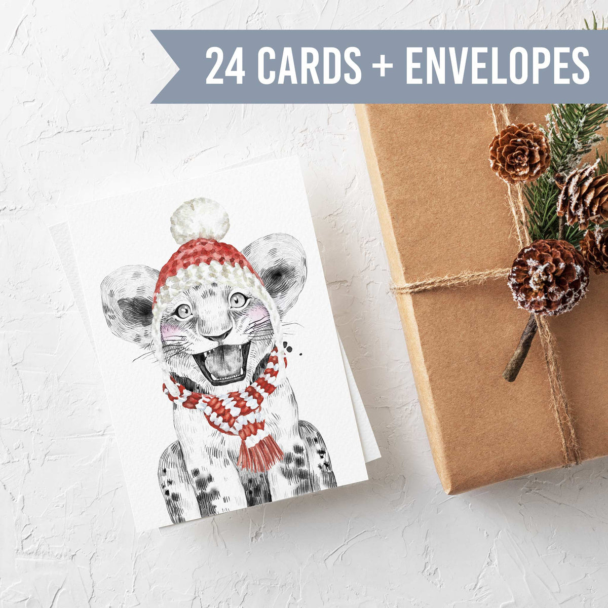 Holiday cards in four designs: llama, bear cub, spotted cub, and sloth, each in knit winter accessories.