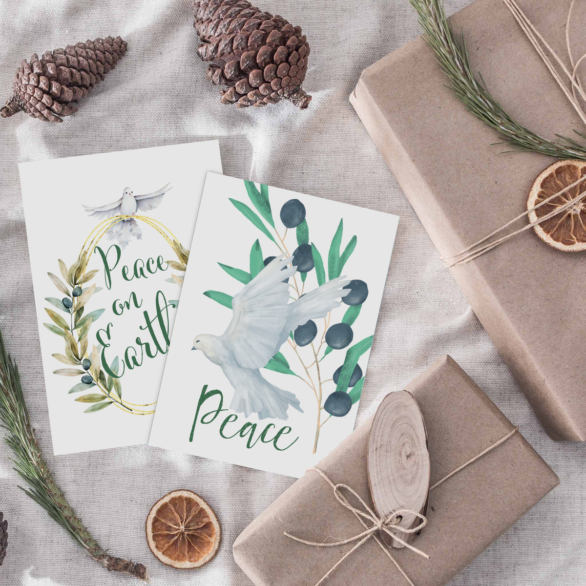 Holiday cards in six designs with white and cream doves, olive branches, and berry sprigs.