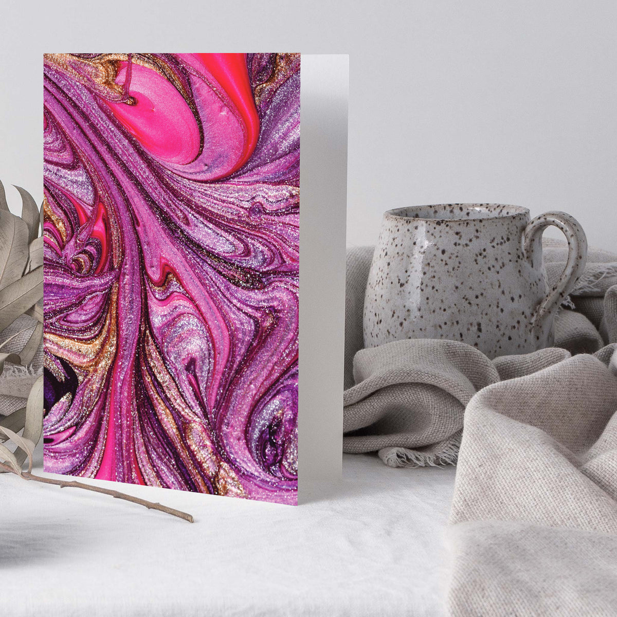 Boxed set of 24 notecards with fluid abstract marbled patterns in bold jewel tones.