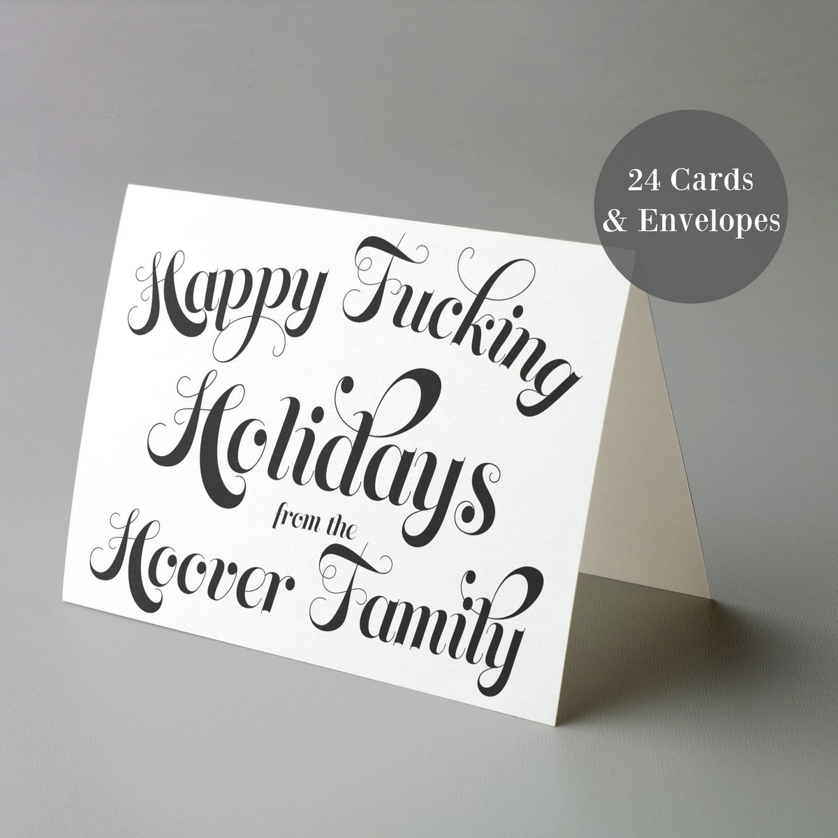 Personalized holiday card reading "Happy Fucking Holidays from the [Surname] Family" in ornate black lettering.