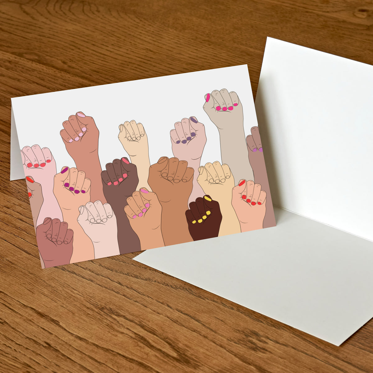 Flat vector illustration of overlapping raised fists spanning pale to deep brown skin tones on white.