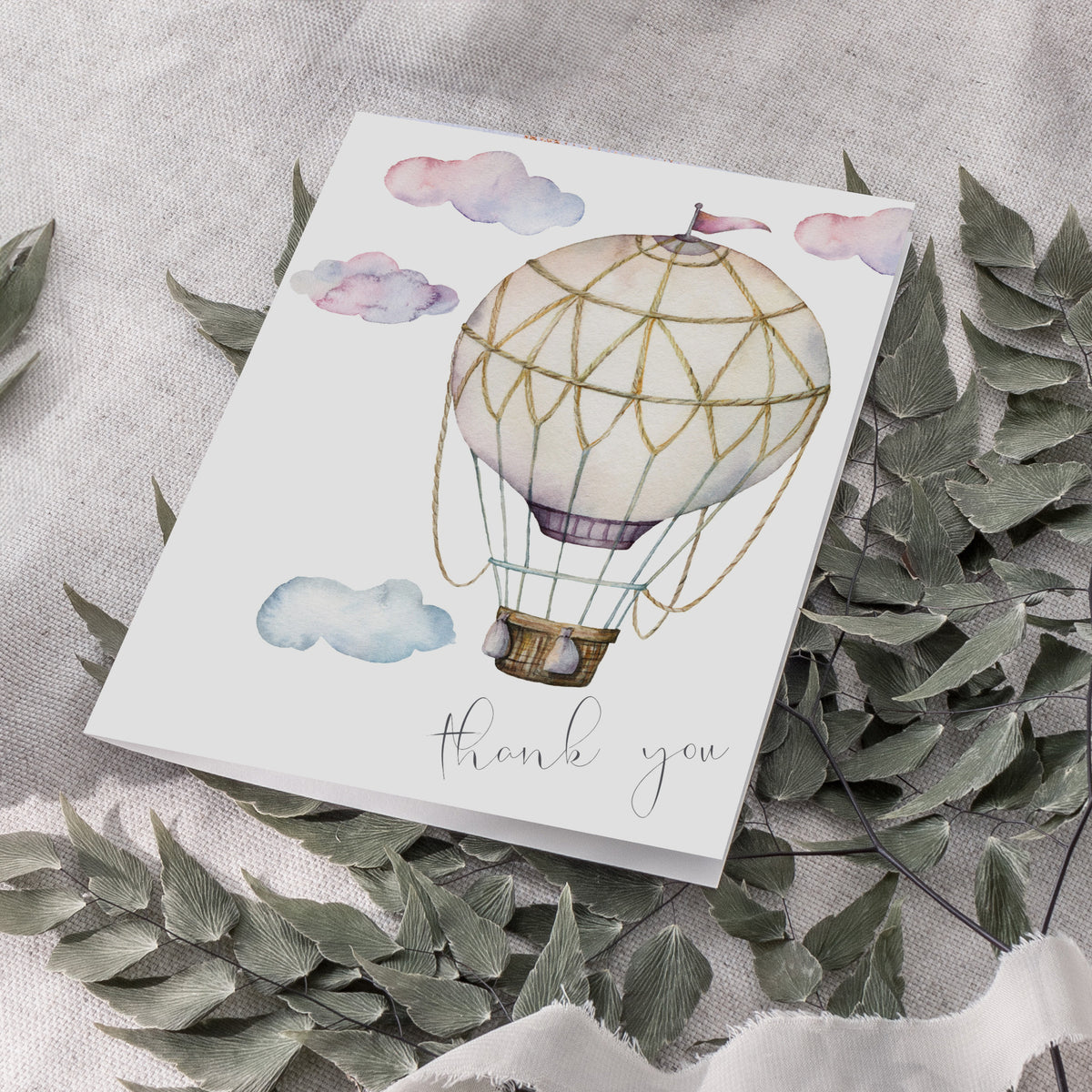 Pastel thank you cards with watercolor-style hot air balloon, clouds, and script text.