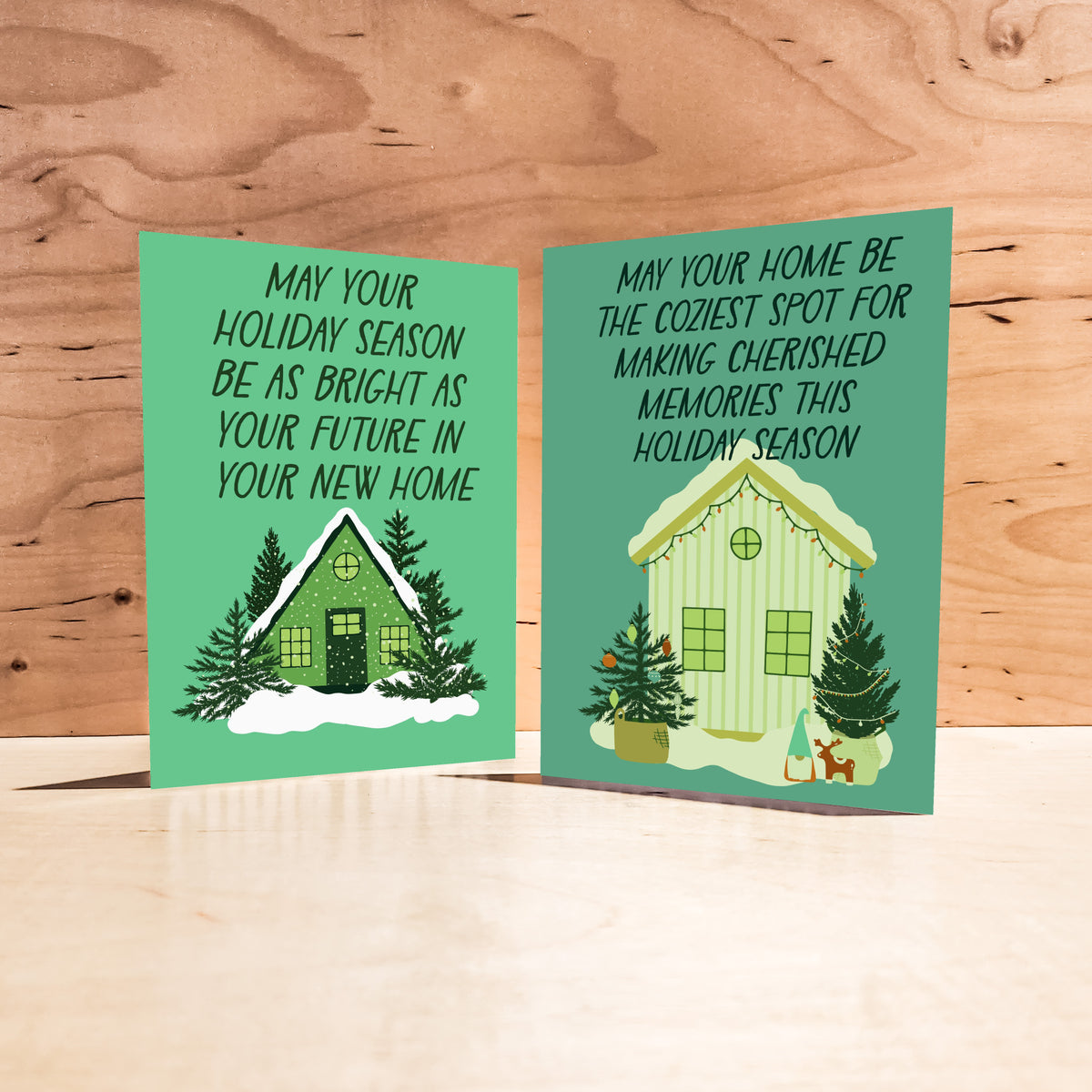 Six Christmas card designs showing a house, front door, striped house, Christmas tree, cake table, and fireplace.