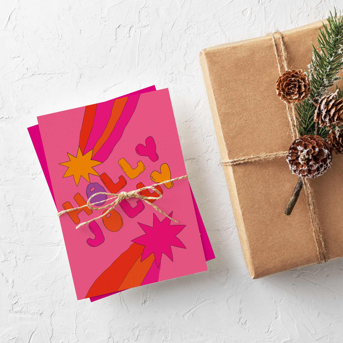 Christmas card set with 12 designs including llama, dinosaur, astronaut, and pixel-art illustrations.
