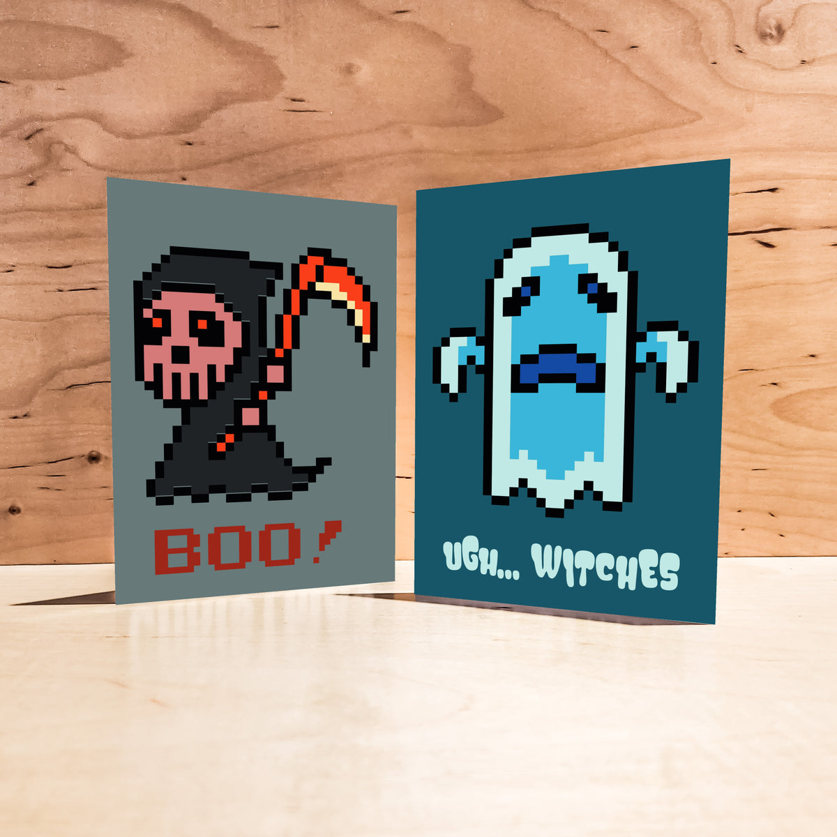 Card Halloween set with blocky pixel art illustrations and playful phrases on each of 4 alternating designs.