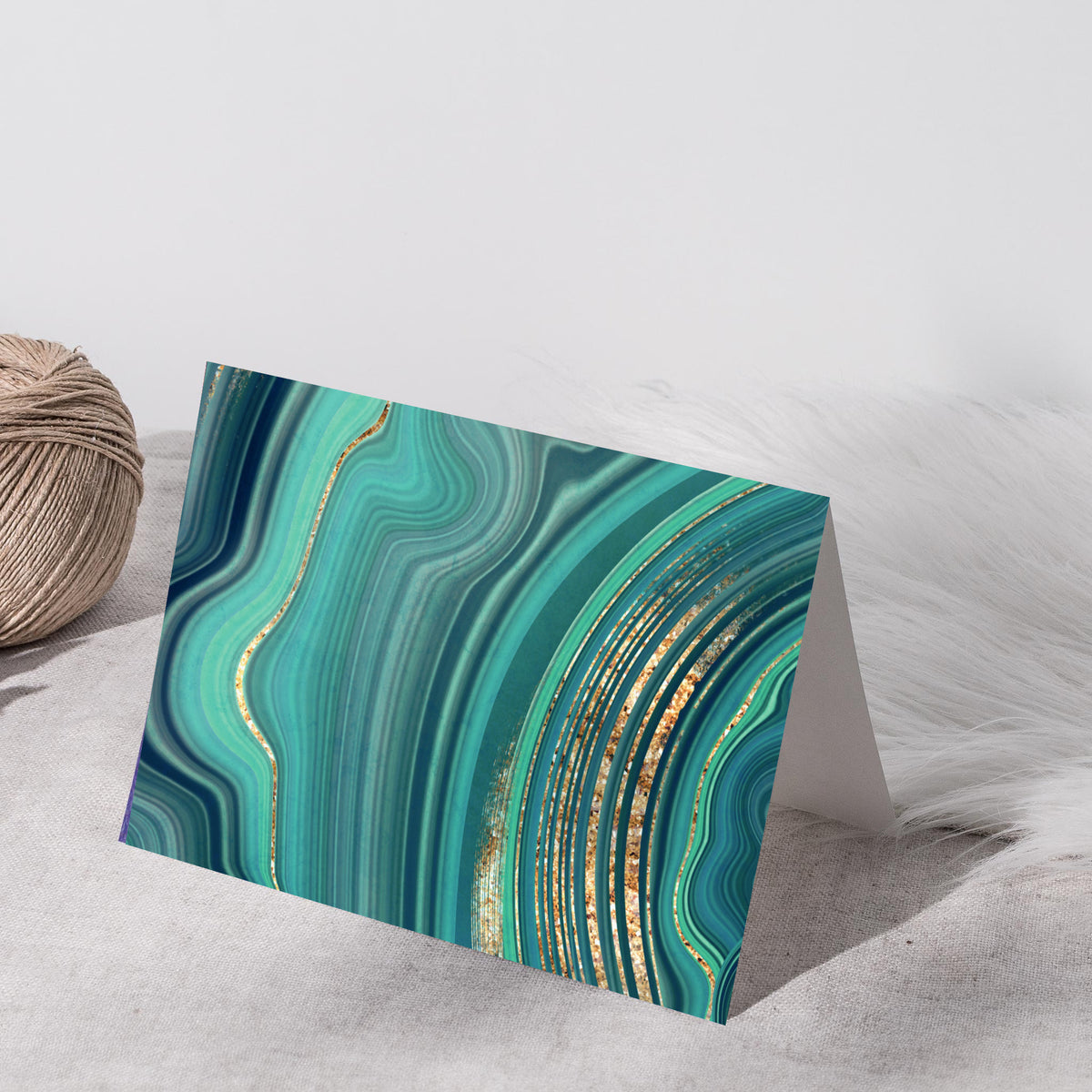 Twenty-four abstract notecards with layered, organic marbled patterns in shades of green and teal.