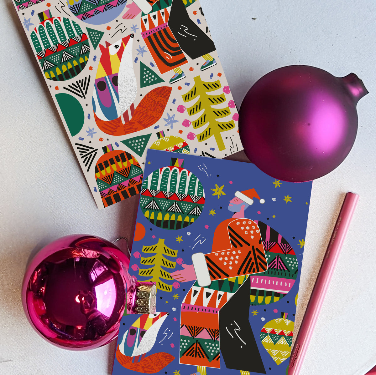 Christmas card pack featuring flat geometric folk-art illustration style throughout.